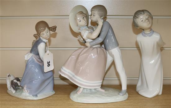 A Lladro figure group, Precious Love, another of a girl with basket and dog and a Zaphir figure of a boy (3) tallest 26cm